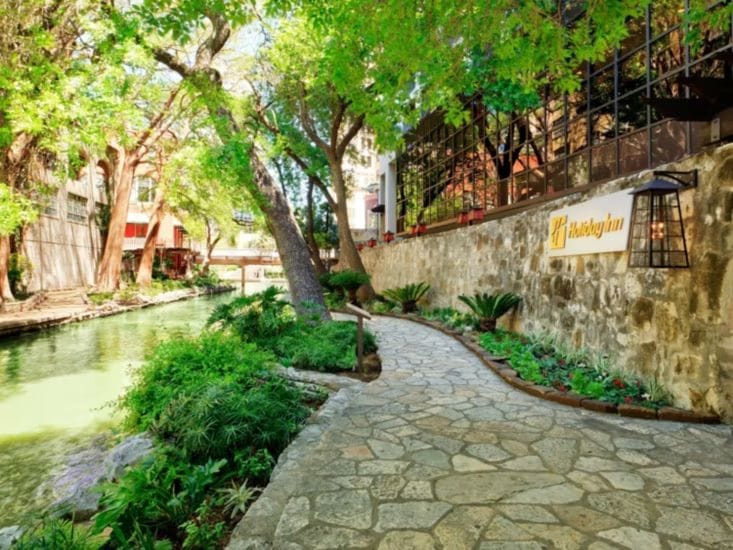 Stone walkway beside the San Antonio River outside the Holiday Inn Riverwalk