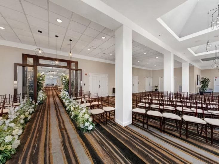 Hotel event room set with rows of chairs